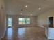 Bright living room features neutral paint, recessed lighting and large windows at 855 Cumberland Rd, Venice, FL 34293