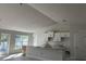 Spacious kitchen with white cabinets and a large island at 2679 Englewood Rd, Venice, FL 34293