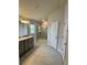 Modern bathroom with large walk-in shower, double vanity with granite countertop, and tile floors at 664 Linden Rd, Venice, FL 34293