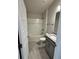 Bathroom features tub and shower combination, vanity with granite top, and wood-look tile floors at 664 Linden Rd, Venice, FL 34293