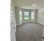 Bright bedroom with bay window and plush carpet, offering a comfortable retreat at 664 Linden Rd, Venice, FL 34293