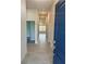 Inviting hallway with tile flooring leading to various rooms, enhancing the home's modern flow at 664 Linden Rd, Venice, FL 34293
