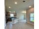 Open kitchen featuring an island with granite countertops, sleek cabinets, and modern appliances at 664 Linden Rd, Venice, FL 34293
