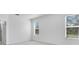 Light and bright bedroom with carpet floors and two large windows at 1580 Laurel Brook Ln, Port Charlotte, FL 33953