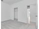 Empty bedroom showing closet and bathroom access at 1580 Laurel Brook Ln, Port Charlotte, FL 33953