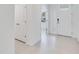 Tiled foyer with white walls, featuring a closet and the home's front door at 1580 Laurel Brook Ln, Port Charlotte, FL 33953