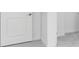 Neutral hallway with white trim and carpeted floor at 1580 Laurel Brook Ln, Port Charlotte, FL 33953