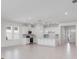 Modern open kitchen with white cabinetry, stainless steel appliances, and a center island at 1580 Laurel Brook Ln, Port Charlotte, FL 33953