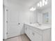 Bright bathroom boasts double vanity and modern lighting at 3165 Novara Ln, Lakewood Ranch, FL 34211