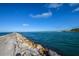 Serene view of a fishing pier extending into the ocean at 915 Barclay Ct, Venice, FL 34293