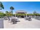 Outdoor deck with a covered seating area offering comfortable seating and table arrangements for relaxing and entertaining at 123 Tidy Island Blvd, Bradenton, FL 34210