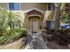 Ground level condo entrance with landscaping and walkway at 3609 45Th W Ter # 102, Bradenton, FL 34210