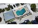 Community pool with surrounding patio and building at 301 S Gulf Blvd # 20, Placida, FL 33946