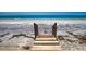Wooden walkway leading to a pristine beach at 301 S Gulf Blvd # 20, Placida, FL 33946