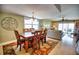 Bright dining room with wood table and hardwood floors at 301 S Gulf Blvd # 20, Placida, FL 33946