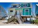 Beachfront duplex with two units, elevated position, and stairs at 301 S Gulf Blvd # 20, Placida, FL 33946
