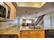 Open kitchen with granite counters and view to living area at 301 S Gulf Blvd # 20, Placida, FL 33946