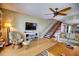 Relaxing living room with comfy seating and built-in shelves at 301 S Gulf Blvd # 20, Placida, FL 33946