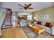 Living room with hardwood floors and access to balcony at 301 S Gulf Blvd # 20, Placida, FL 33946