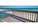 Deck with railing overlooking the ocean and beach at 301 S Gulf Blvd # 20, Placida, FL 33946