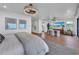 Bright bedroom with ocean views, large TV, and sitting area at 809 N Shore Dr, Anna Maria, FL 34216