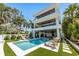 Luxury beachfront home with private pool and lush landscaping at 809 N Shore Dr, Anna Maria, FL 34216