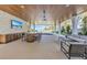Outdoor patio with a built-in bar, seating area, and pool views at 809 N Shore Dr, Anna Maria, FL 34216