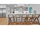 Modern wet bar with glass-front cabinets and white countertop at 809 N Shore Dr, Anna Maria, FL 34216
