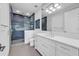 Modern bathroom with walk-in shower and double vanity at 809 N Shore Dr, Anna Maria, FL 34216