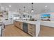 Modern kitchen with large island and high-end appliances at 809 N Shore Dr, Anna Maria, FL 34216