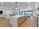 Open concept kitchen with large island and ocean views at 809 N Shore Dr, Anna Maria, FL 34216