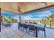 Spacious patio with ocean views and dining furniture at 809 N Shore Dr, Anna Maria, FL 34216