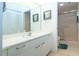 Bright bathroom with white vanity and a shower/tub combo at 3780 Pinebrook Cir # 504, Bradenton, FL 34209