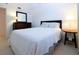 Charming bedroom with a comfortable bed and nightstand at 3780 Pinebrook Cir # 504, Bradenton, FL 34209