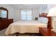 Spacious main bedroom with a king-size bed and dresser at 3780 Pinebrook Cir # 504, Bradenton, FL 34209