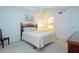 Well-lit bedroom with a comfortable bed and ceiling fan at 3780 Pinebrook Cir # 504, Bradenton, FL 34209