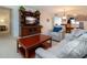 Bright living room features comfy seating, a large TV stand, and a coffee table at 3780 Pinebrook Cir # 504, Bradenton, FL 34209