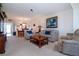 Relaxing living room with comfortable seating and a view of dining area at 3780 Pinebrook Cir # 504, Bradenton, FL 34209