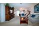 Open living room showcasing comfortable seating and a view into dining area at 3780 Pinebrook Cir # 504, Bradenton, FL 34209