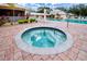 Circular hot tub with brick surround at 3780 Pinebrook Cir # 504, Bradenton, FL 34209