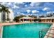 Refreshing community pool with surrounding patio at 3780 Pinebrook Cir # 504, Bradenton, FL 34209