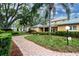 Brick pathway leads to community clubhouse at 3780 Pinebrook Cir # 504, Bradenton, FL 34209