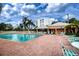 Relaxing community pool with lounge chairs at 3780 Pinebrook Cir # 504, Bradenton, FL 34209