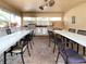 Outdoor kitchen with stainless steel appliances and seating for grilling and dining at 3780 Pinebrook Cir # 504, Bradenton, FL 34209