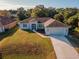 Aerial view of single-Gathering home with driveway at 3523 Sapelo Ave, North Port, FL 34286