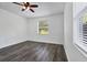 Spacious bedroom with wood-look vinyl flooring and window blinds at 3523 Sapelo Ave, North Port, FL 34286