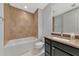 Bathroom with soaking tub and dark brown vanity at 10520 Boardwalk Loop # 401, Lakewood Ranch, FL 34202