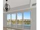 Bright dining room with sliding glass doors offering a lake view at 10520 Boardwalk Loop # 401, Lakewood Ranch, FL 34202
