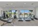 Fitness center with modern exercise equipment and lake views at 10520 Boardwalk Loop # 401, Lakewood Ranch, FL 34202