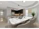 Open kitchen features a large marble top island, stainless appliances and dark wood cabinets at 10520 Boardwalk Loop # 401, Lakewood Ranch, FL 34202